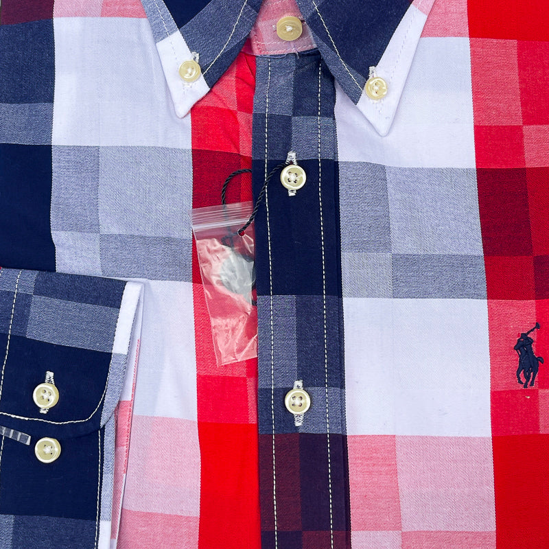Close-up of a Polo Ralph Lauren plaid button-down shirt with red, navy, white, and light gray checks, featuring gold-tone buttons and the signature polo pony logo.